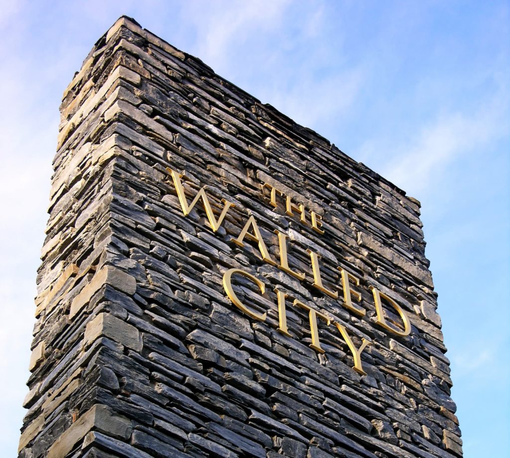 Striking stone gateway signs for Derry~Londonderry.